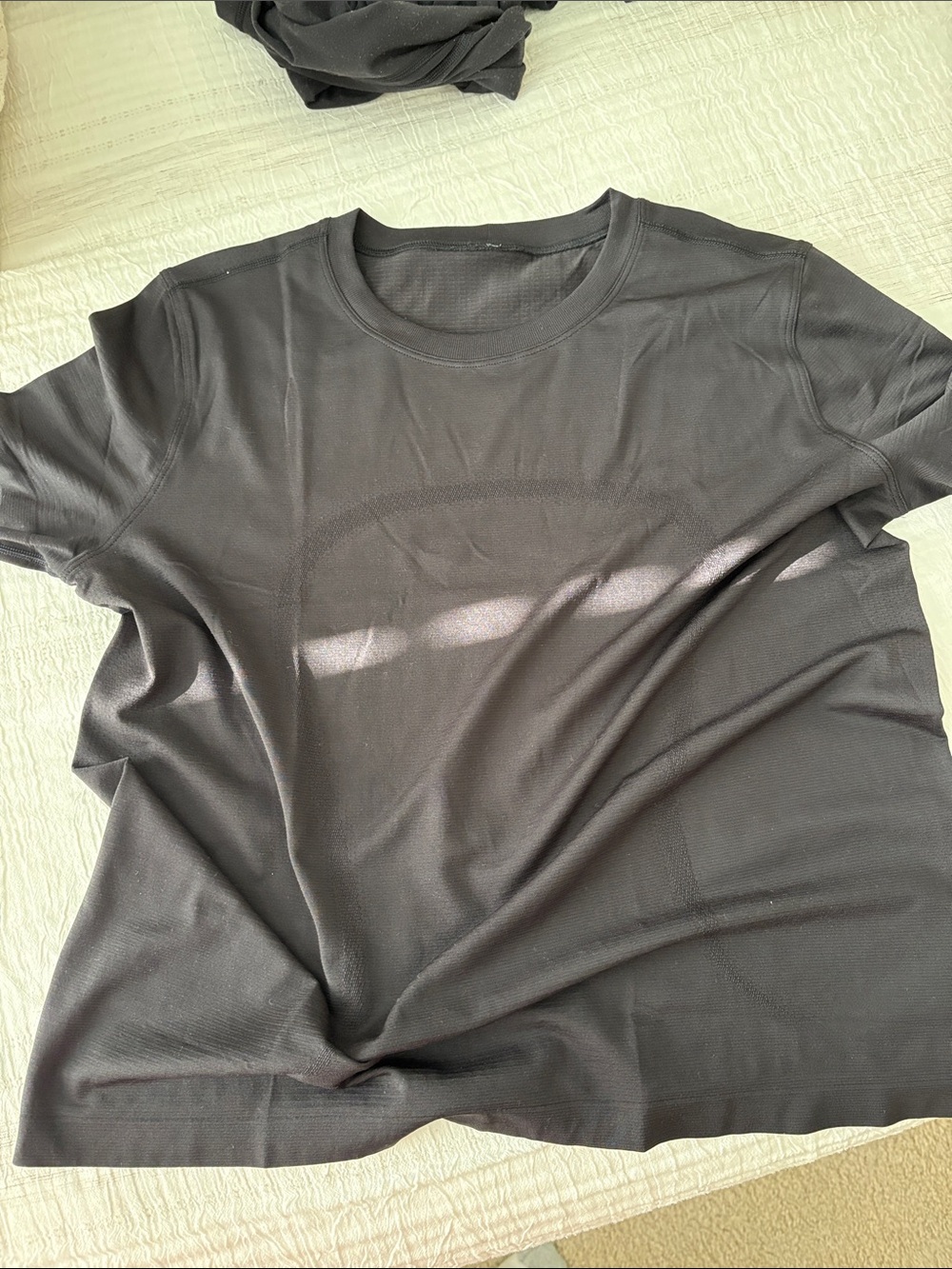 Women’s boxy swifltly Black Crew Neck Performance Tee